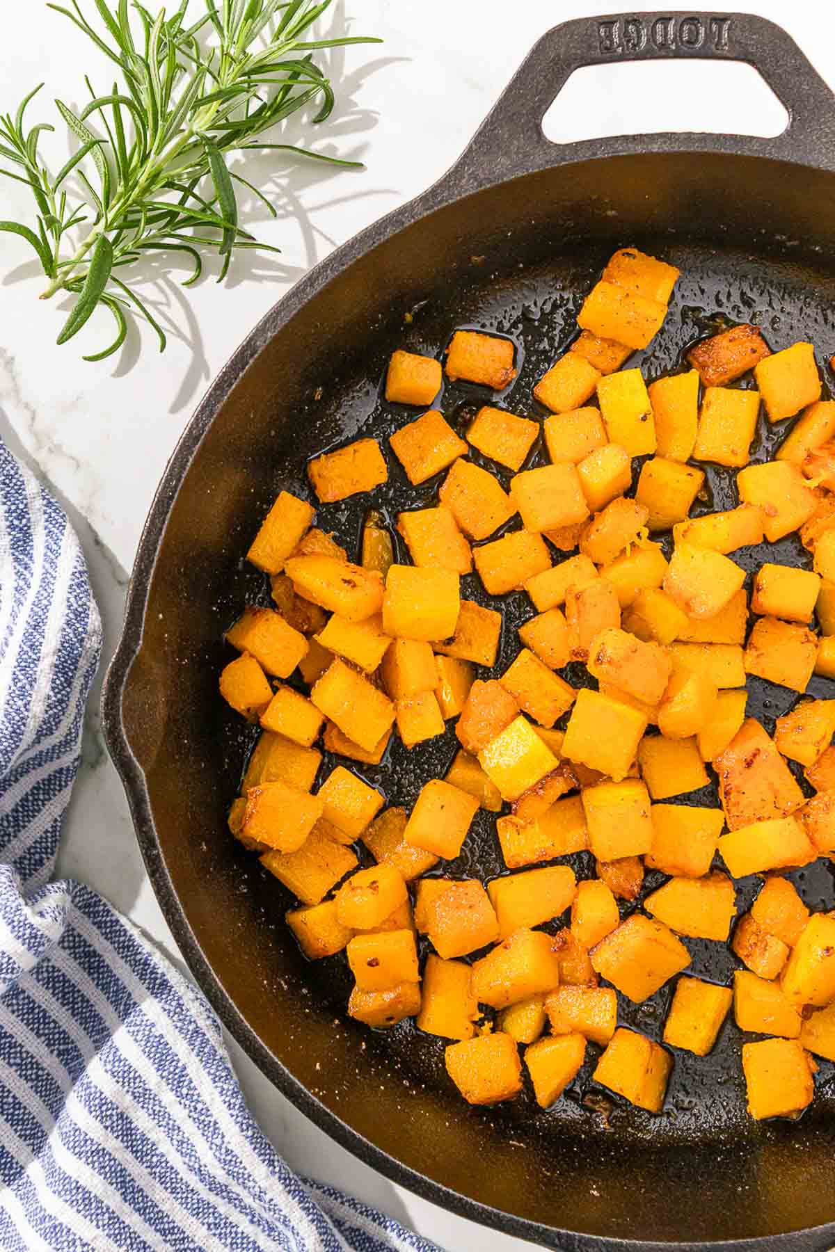 Roasted butternut squash in a cast iron skillet.