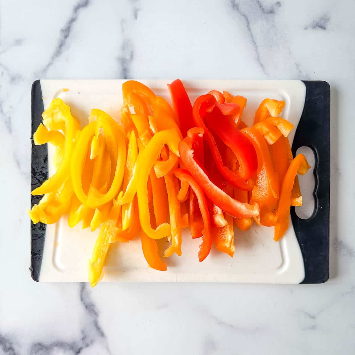 Sliced peppers on a cutting board.