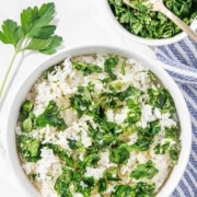 A bowl of chimichurri rice with a blue and white linen.
